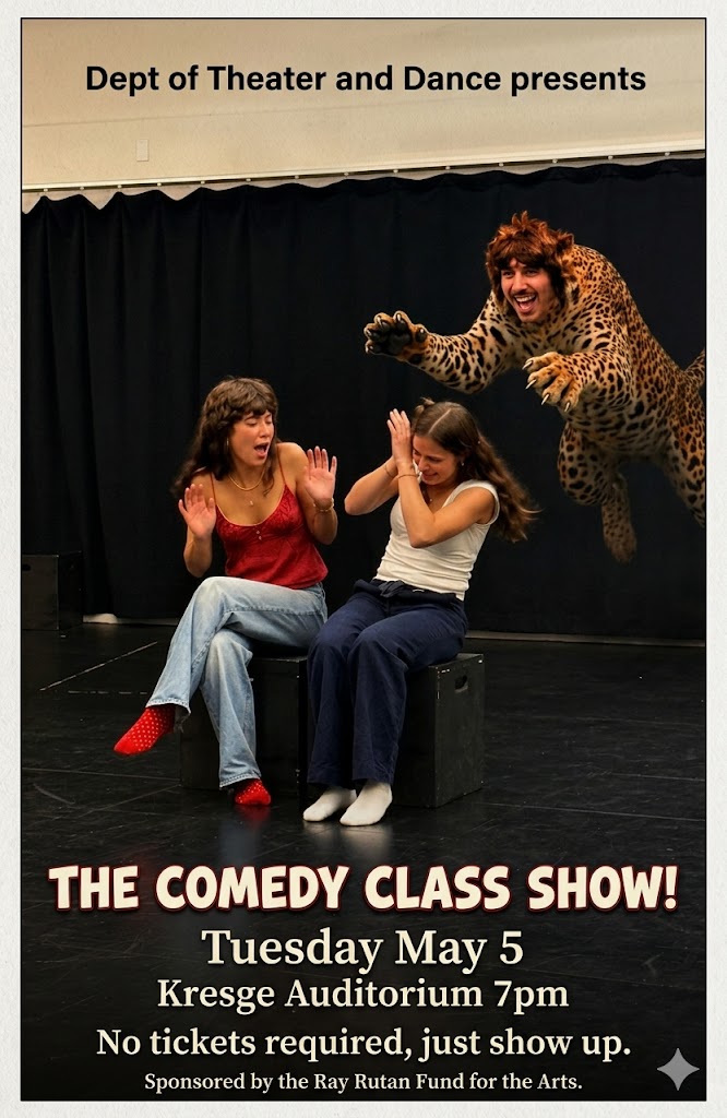 Students clowning onstage, two girls laughing as guy dressed like a tiger leaps out at them.
