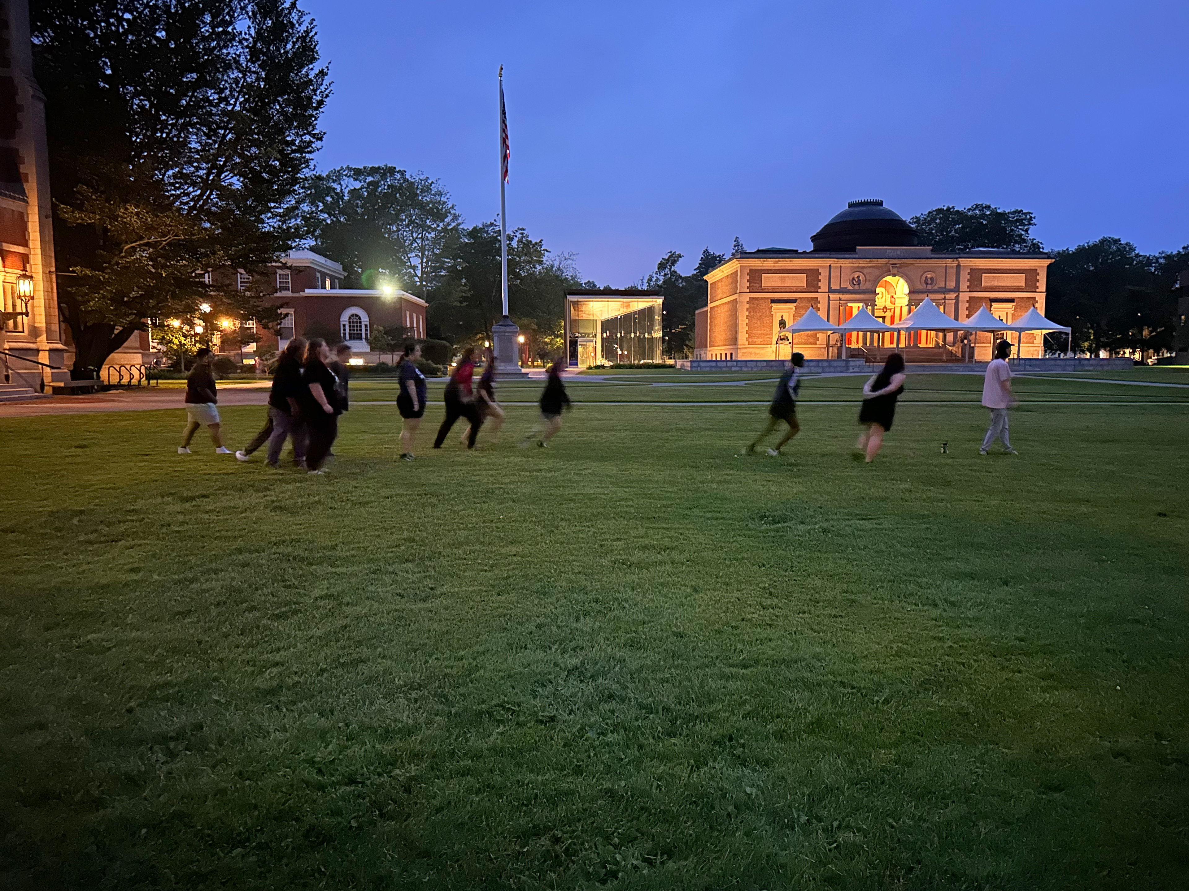 Students play capture the flag at dusk