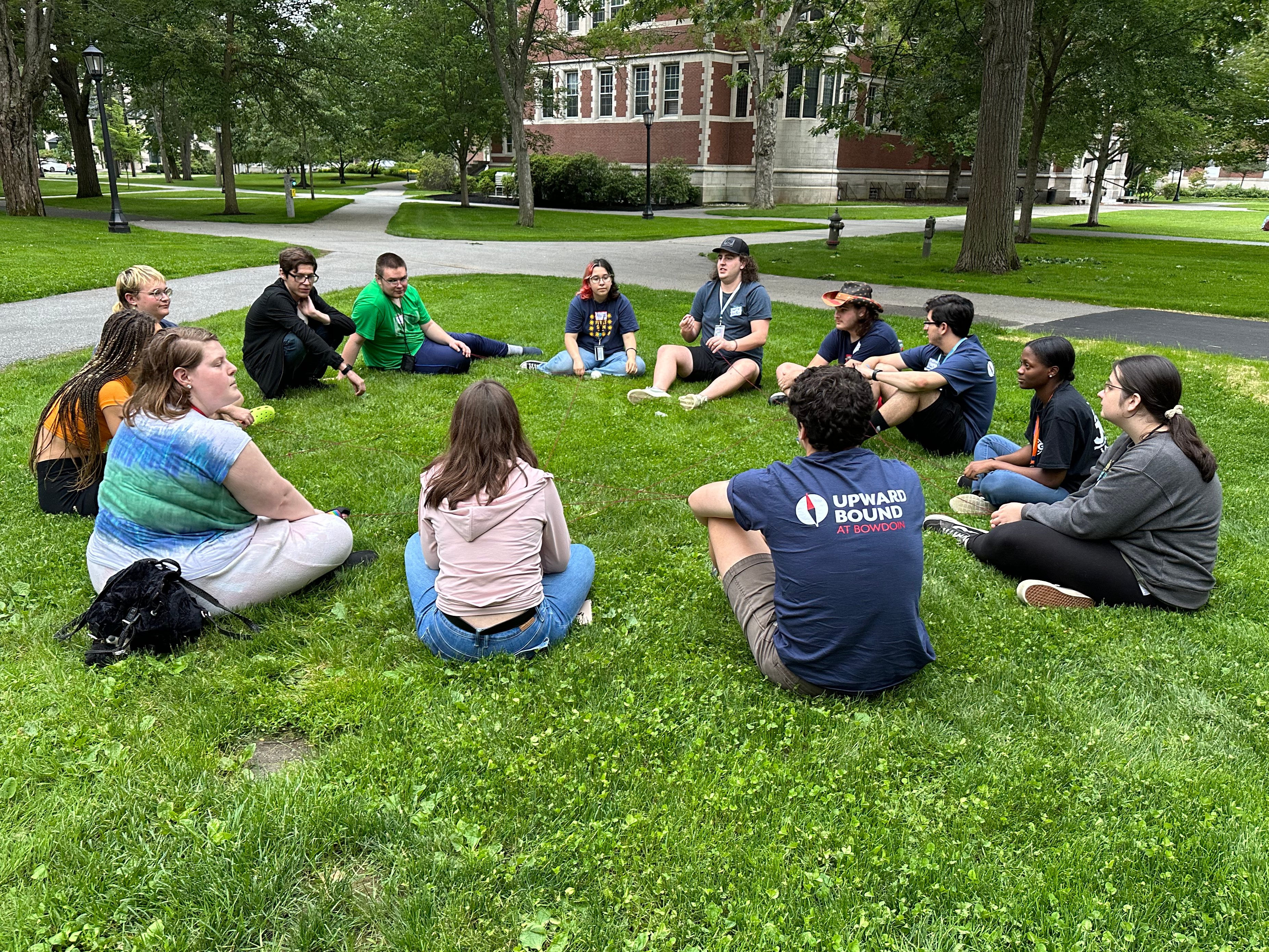 students in a circle on the quad